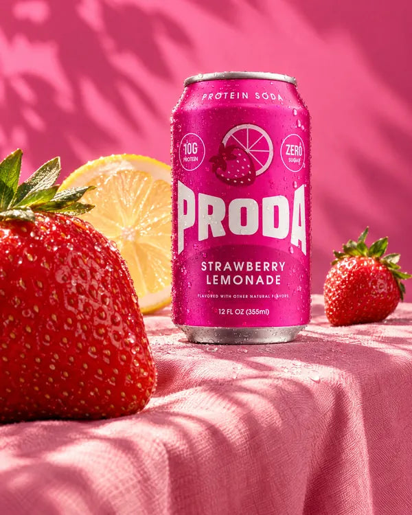 A can of PRODA Strawberry Lemonade with strawberries and lemon