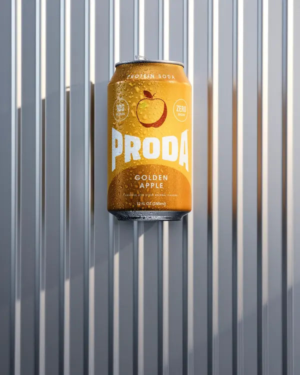A can of PRODA Golden Apple against a metal wall