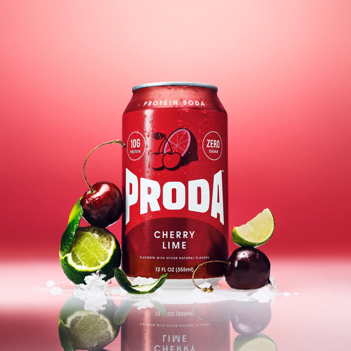A can of PRODA Cherry Lime with dark cherries and lime halves on a cherry-red backdrop