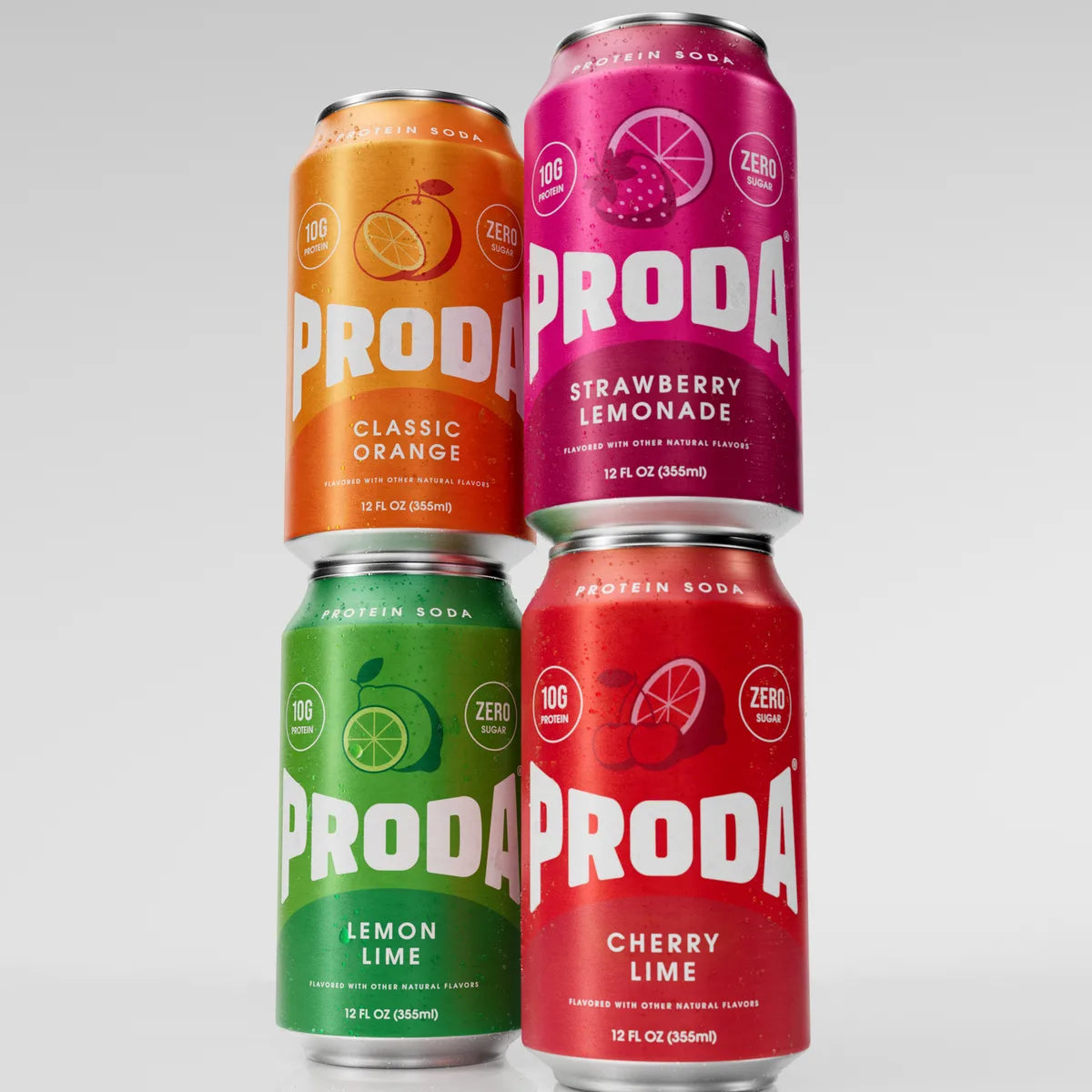 Cans of PRODA Classic Orange and Strawberry Lemonade stacked on Lemon Lime and Cherry Lime