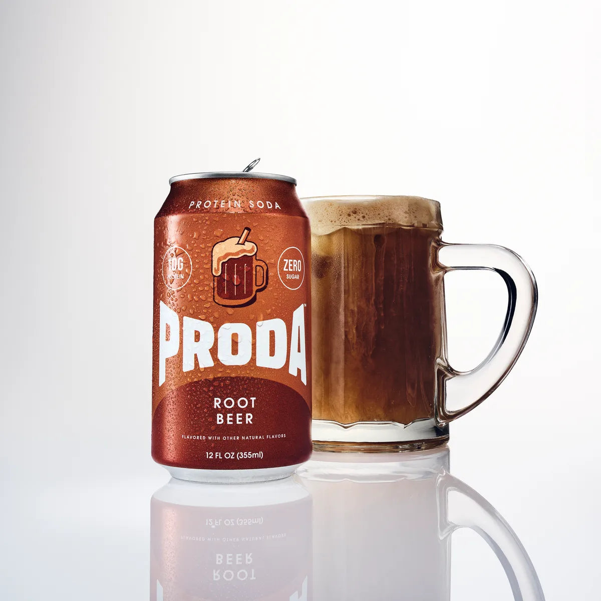 A can of PRODA Root Beer beside a frosted mug of root beer